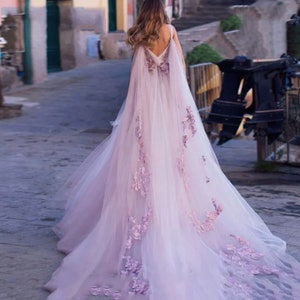 Aurora | Blended Lilac and Dusk Pink Wedding Gown with 3D Flowers and Detachable Cape |  Bohemian Romance and Whimsical Beauty.