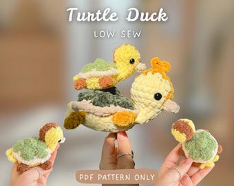 May include: Crochet plushies featuring a large yellow and green turtle duck with a smaller turtle duck on its back, plus two smaller individual turtle duck plushies. Text reads: Turtle Duck LOW SEW and PDF PATTERN ONLY.