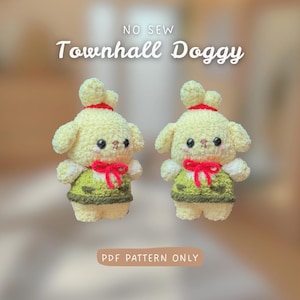 May include: Two cream-coloured dog plush toys with red bows and green vests. The toys have black eyes and small ears. The text "NO SEW Townhall Doggy" is above the toys, and "PDF PATTERN ONLY" is below.