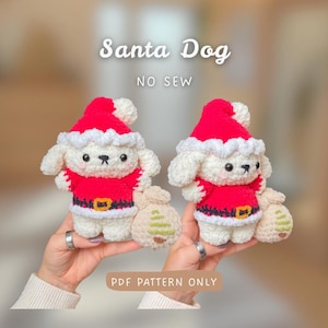 May include: Two crocheted Santa Dog figures, each wearing a red Santa hat and jacket with a black belt. The dogs are holding a beige sack with a green Christmas tree design. The text "Santa Dog" and "NO SEW" are at the top, and "PDF PATTERN ONLY" is at the bottom.