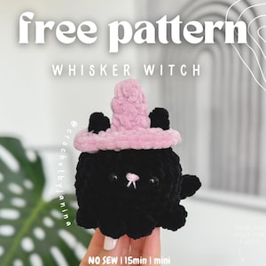 May include: A black crocheted cat wearing a pink crocheted witch hat. The cat is small and has a cute face. The text "free pattern" is at the top of the image, and the text "WHISKER WITCH" is below it. The text "NO SEW | 15min | mini" is at the bottom of the image.