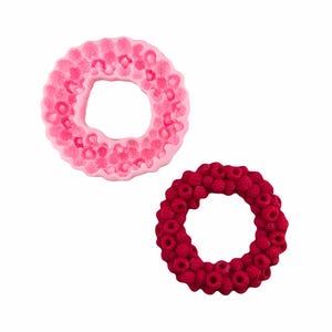 May include: Two silicone moulds for baking, one pink and one red, shaped like a wreath of raspberries.
