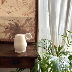 White minimal vase with a round handle image 3