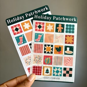 May include: Two rectangular cards with a green border and the text "Holiday Patchwork" at the top. Each card features a grid of colorful holiday-themed squares, including a stocking, star, and gingerbread man. The bottom of the card reads "COZY CORNER Studio."