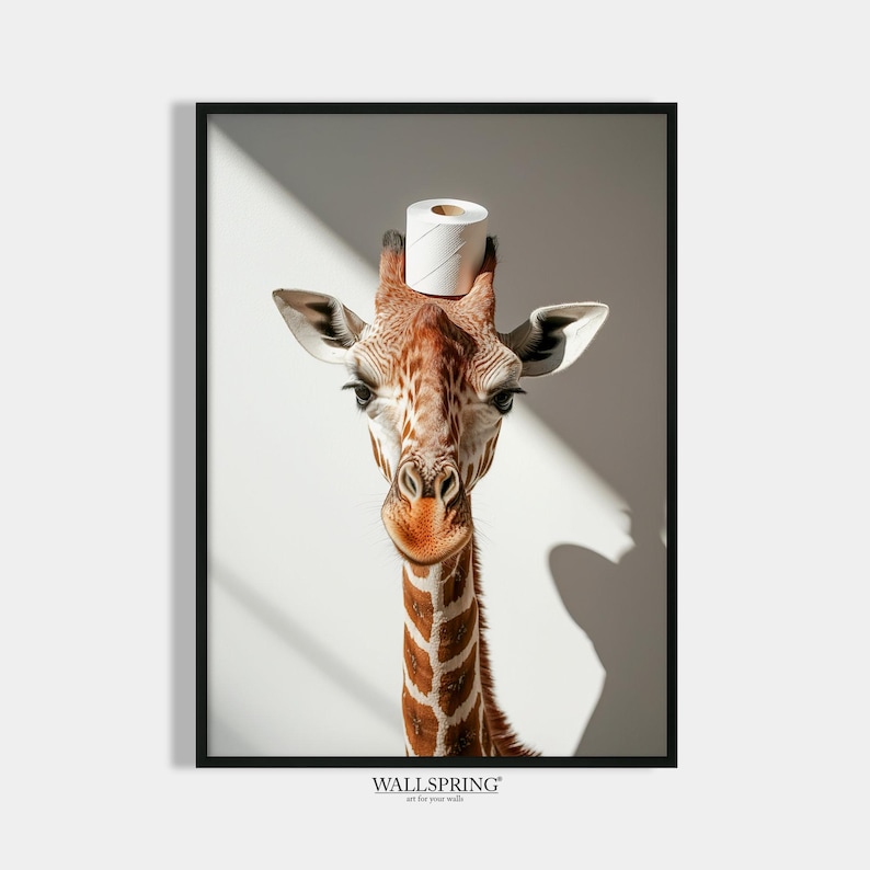 May include: A giraffe with a white toilet paper roll on its head. The giraffe is looking directly at the camera. The background is a white wall with shadows.