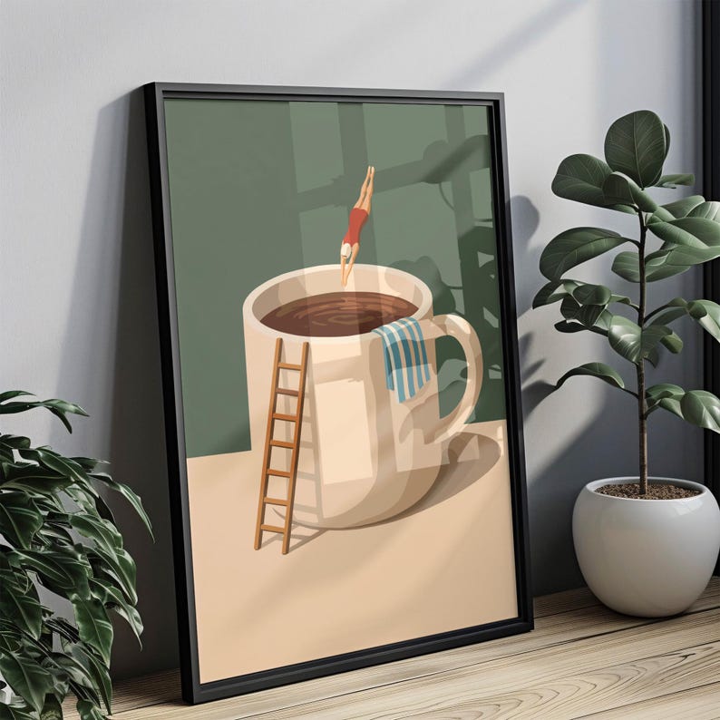 May include: Framed art print featuring a whimsical illustration of a person diving into a giant coffee cup filled with dark liquid. A small wooden ladder and a striped towel are included. The artwork is set against a muted green background.