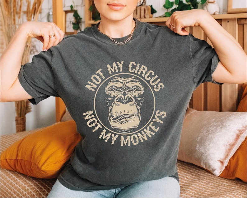 a woman wearing a t - shirt that says not my circus, not my money