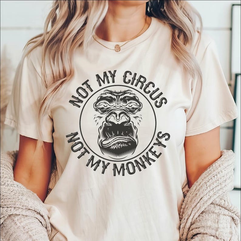 a woman wearing a t - shirt that says not my circus, not my monkeys