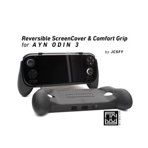 May include: Black screen cover and comfort grip for AYN ODIN 3. The screen cover is on top of the comfort grip. The text on the image says "Reversible ScreenCover & Comfort Grip for AYN ODIN 3 by JCSFY".