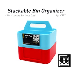 May include: A stackable bin organizer in light blue and red, designed to hold standard business cards. The bin has a handle and a label that says "Thank You" with a QR code. The text "Stackable Bin Organizer" is at the top.
