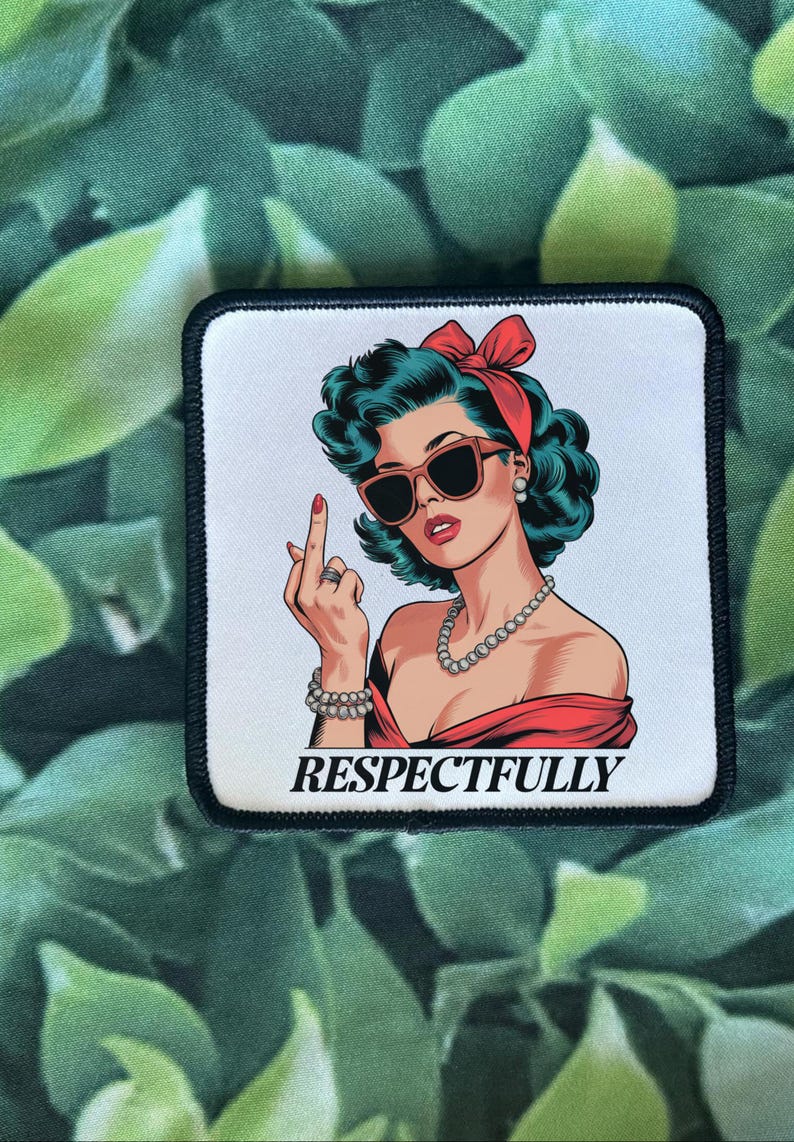 May include: A white patch with a black border features a cartoon illustration of a woman with red lipstick, sunglasses, and a red headband. She is giving the middle finger and the text "RESPECTFULLY" is printed below her.