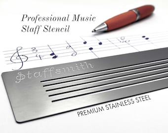 May include: A stainless steel music staff stencil with the word "staffsmith" engraved on it. The stencil is placed over a sheet of music with handwritten notes and a pen. The text "Professional Music Staff Stencil" is at the top.