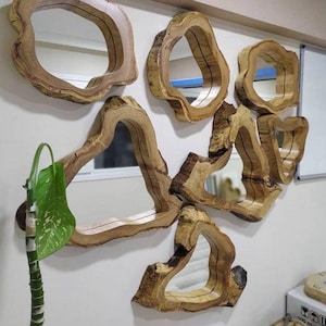 Mirror with natural wooden frame