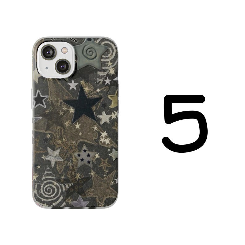 May include: A phone case with a pattern of stars in various sizes and colors, including black, white, and gold. The case has a clear border and a camera cutout. The number 5 is visible in black on the right side.