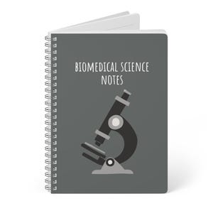 May include: A spiral-bound notebook with a gray cover featuring the text "BIOMEDICAL SCIENCE NOTES" above a black and gray illustration of a microscope. The notebook is open, revealing white pages.