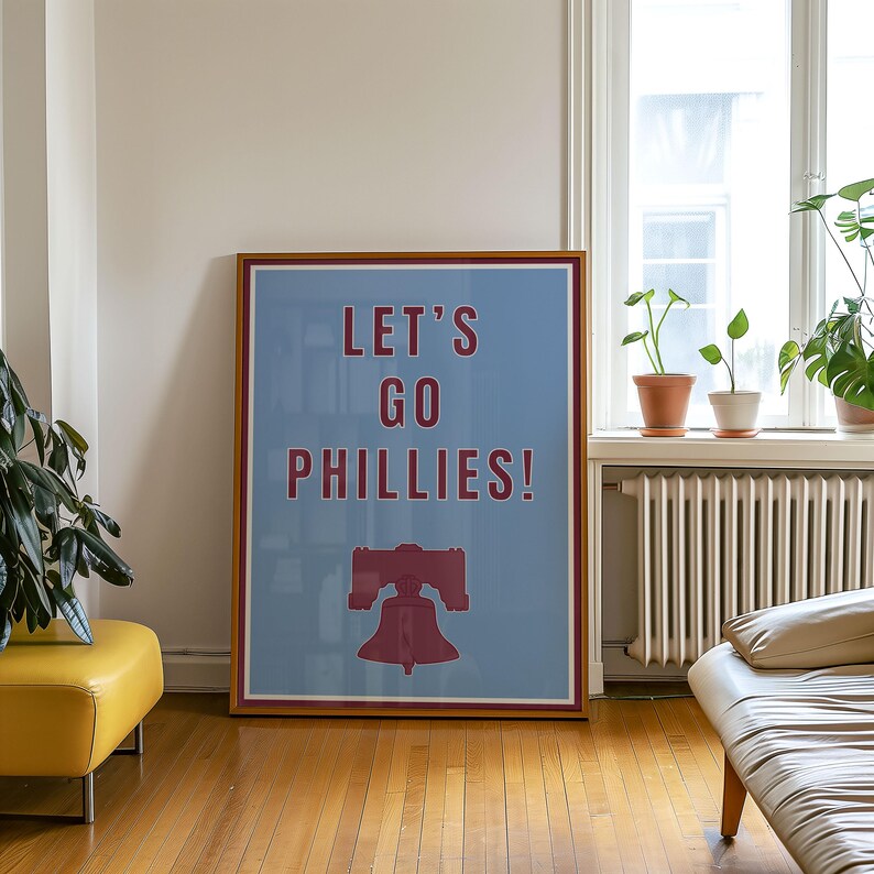 Philadelphia Phillies Baseball Poster in the team's retro or vintage throwback uniform colors maroon red and baby powder blue. States Lets Go Phillies in the maroon red color and the background of the poster is the light blue. A great poster gift for Phillies fans and for kids or children's rooms who want a Philadelphia themed bedroom or game room. Poster comes in a variety of sizes from small sizes to large poster sizes.