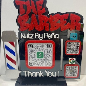 Puede incluir: Un letrero de acrílico negro con el texto THE BARBER en purpurina roja y el texto Kutz By Peña en blanco. Incluye un gráfico de poste de barbero, un código QR de Cash App, un icono de Google y dos códigos QR con el texto Thank You! abajo.