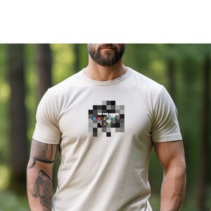 May include: A beige t-shirt with a black and white pixelated design that reads "im not crazy i'm creatively insane".