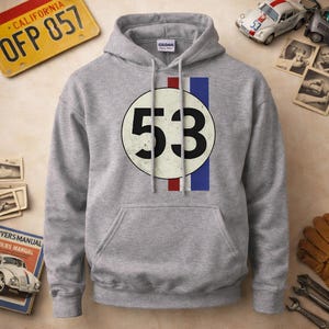 May include: A grey hooded sweatshirt with a large white circle displaying the number 53 in black. Vertical red and blue stripes are to the right of the circle. The sweatshirt has a front pocket and a drawstring hood. The design is inspired by a classic racing car.