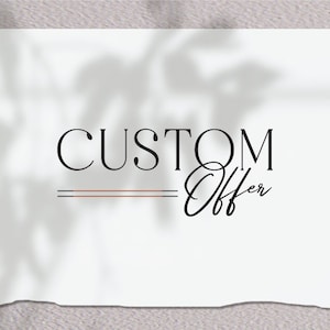 May include: A white paper with the words "CUSTOM Offer" in black script and serif fonts. Two horizontal lines, one brown and one navy, are below the word "CUSTOM". The paper has a shadow overlay.