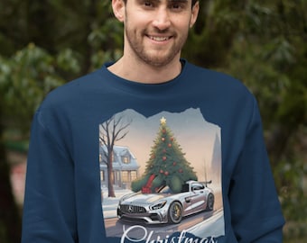 May include: A navy blue sweatshirt with a Christmas-themed design featuring a silver car carrying a decorated Christmas tree. The text "Christmas" is printed below the image.