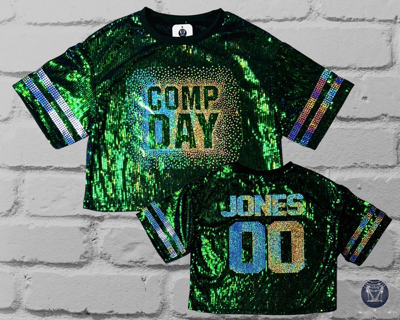 Comp Day Bling Sequin Top, Comp Day text in a scattered spangle bling holographic design on the front, Cutom bling name and number on the back, custom bling jersey sleeve stripes on a green full sequin top, Custom bling, Custom Sequin Shirt, Football Bling, Cheer Bling, Birthday Bling, scattered spangle bling holographic design on the front, Custom bling, Custom Sequin Shirt, Football Bling, Cheer Bling, Birthday Bling, Sports Bling, Custom Name and Number