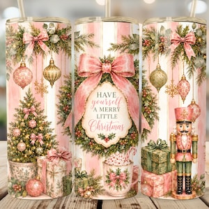 May include: A cylindrical tumbler featuring a pink and white striped background with a Christmas theme. The design includes a decorated tree, a nutcracker, wrapped gifts, ornaments, and a wreath with the text Have yourself A MERRY LITTLE Christmas.