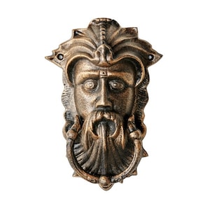 May include: A bronze door knocker in the shape of a man's face with a beard and a ring for knocking.