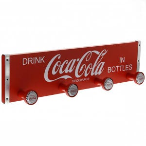 May include: Red Coca-Cola wall-mounted coat rack with four bottle cap hooks. The rack features the Coca-Cola logo and the text "Drink Coca-Cola in Bottles".