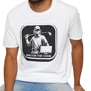 May include: White t-shirt with a black and white graphic of a golfer holding a golf club and a laptop. The text "Par for the Code" is below the graphic.