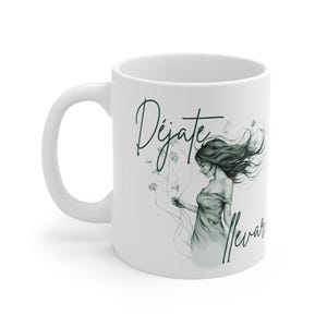 May include: White ceramic mug featuring a black and white illustration of a woman with flowing hair and the Spanish text "Déjate llevar". The mug has a curved handle and a glossy finish.