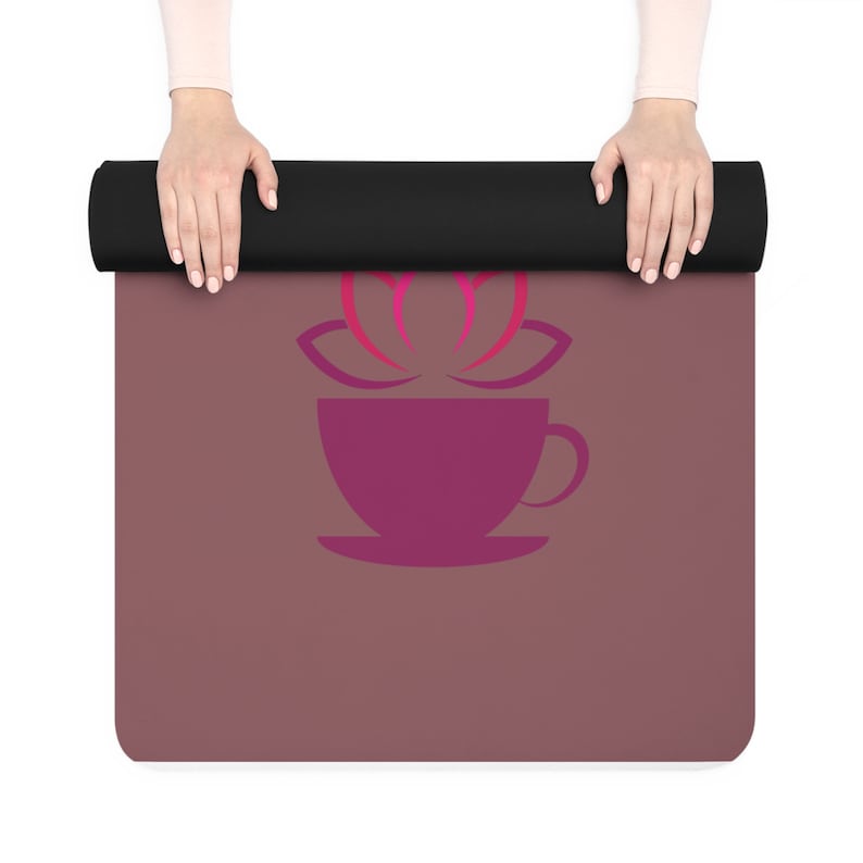 May include: A purple yoga mat with a stylized pink lotus flower and a purple coffee cup design.