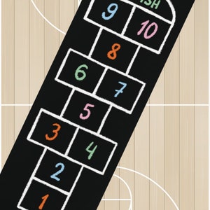 May include: Black hopscotch mat with white chalk-style lines and colorful numbers. The mat features the word "FINISH" at the top and numbers 1 through 10. The mat is rectangular and designed for outdoor or indoor play.