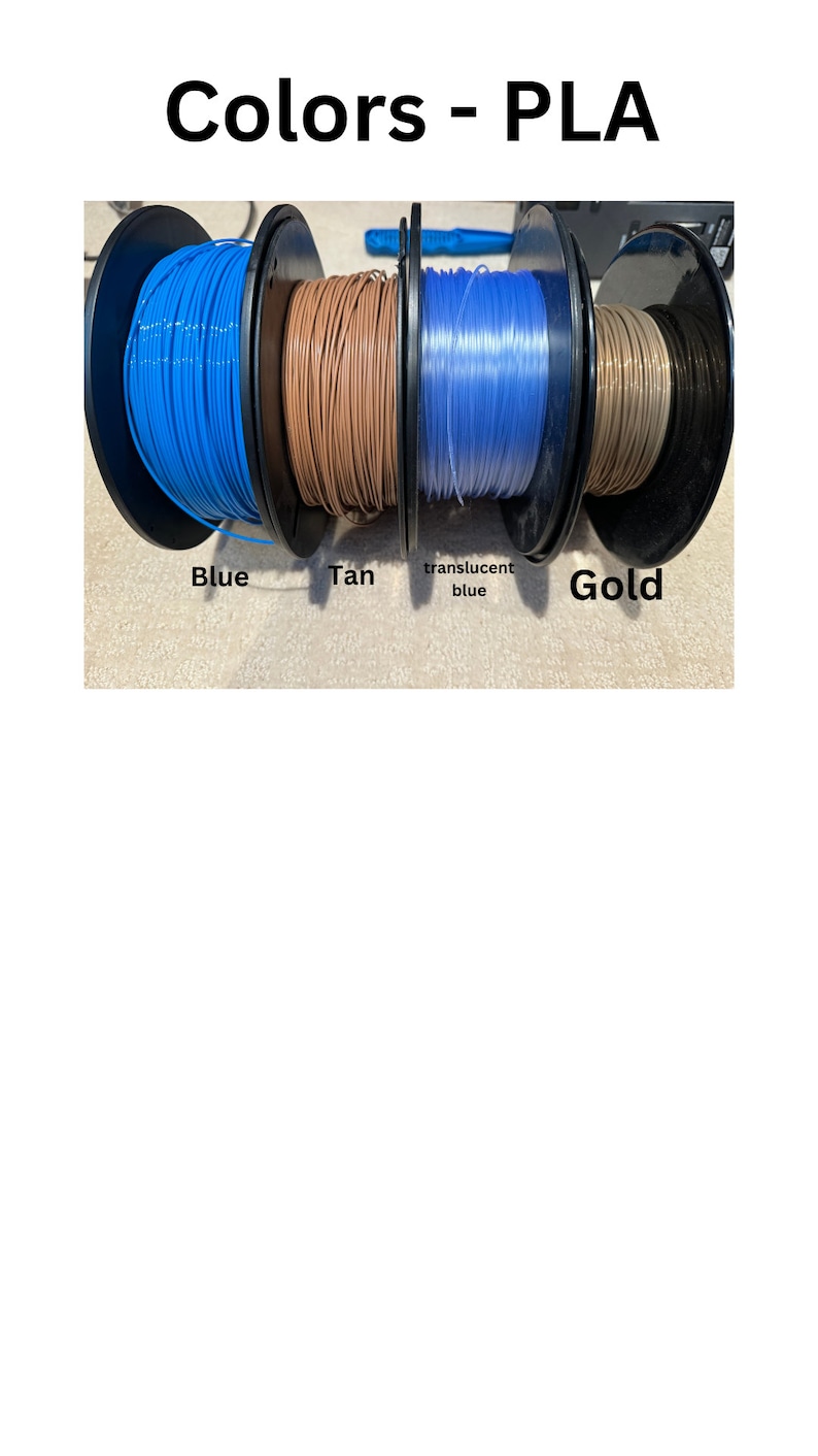 May include: Four spools of filament for 3D printing. The spools are labeled "Blue", "Tan", "translucent blue", and "Gold".