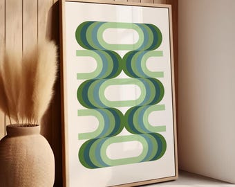 May include: Abstract geometric print with a repeating pattern of green and blue curved shapes on a white background. The print is framed in a light wood frame.