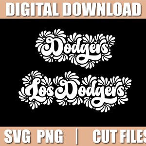 May include: A digital download graphic on a black background. The image features the word "Dodgers" in white script above "Los Dodgers" in white script. Both are decorated with floral accents. The words "DIGITAL DOWNLOAD" and "SVG PNG | CUT FILES" are also present.