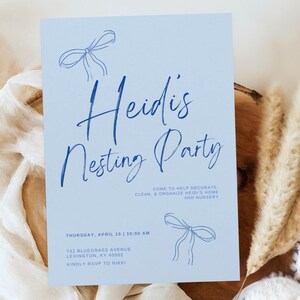 May include: Blue and white invitation for a nesting party. The invitation says "Heidi's Nesting Party" and includes the date, time, address, and RSVP information.