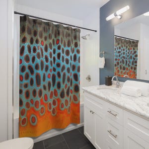 May include: A shower curtain with a colorful abstract pattern of blue, orange, and red circles. The pattern resembles the skin of a fish.