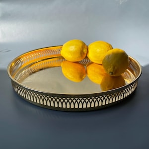 Vintage brass plated serving tray with ornate floral motif and embossed rim. Home display decor. 30 cm = 11’8 inches. Fruit tray, platter