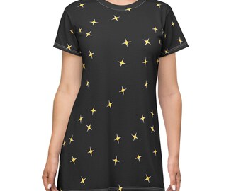May include: Black dress with a pattern of yellow stars. The dress has short sleeves and a round neckline. The stars are evenly spaced across the fabric. The dress is knee-length.