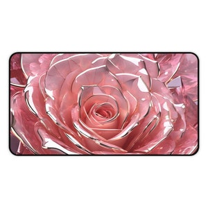 May include: A close-up of a pink rose with a glossy finish. The rose petals are arranged in a spiral pattern, creating a beautiful and delicate design.