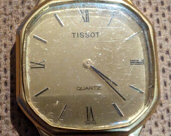 Vintage Tissot quartz watch with new battery and new leather band. keeps perfect time.