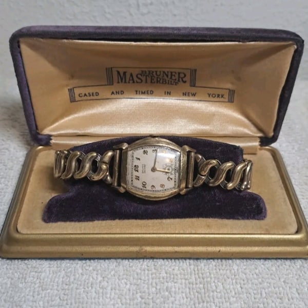 Bruner Masterbuilt watch with original case. Runs Great condition for its age.