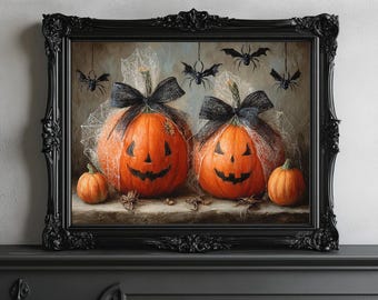Op de afbeelding: Een ingelijst Halloween-schilderij met twee uitgesneden oranje pompoenen met zwarte strikken en spinnenwebben. Kleine pompoenen en hangende vleermuizen maken de enge scène compleet. De sierlijke zwarte lijst voegt een klassieke touch toe.