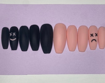 Matte pink and black smiley/sad face press on nails