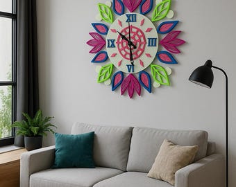 May include: A decorative wall clock with a floral design. The clock features a white face with Roman numerals and a pink and green floral border. The clock is mounted on a white wall above a gray sofa.