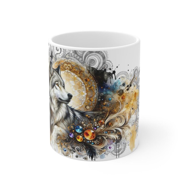 May include: White ceramic mug featuring a watercolor illustration of a wolf with a detailed design. The artwork includes a golden moon, colorful gems, and swirling patterns. The mug is a standard 11 oz size.