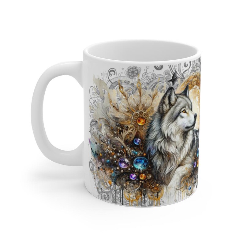 May include: White ceramic mug featuring a detailed illustration of a wolf with gray and white fur, set against a backdrop of ornate, jewel-toned embellishments. The design includes gold and jewel accents.