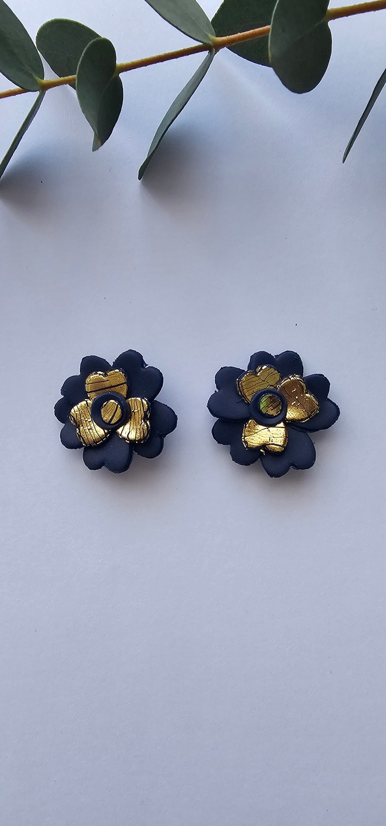 Dark blue earrings with golden colour petals inside image 1