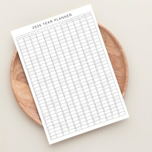 Plan your year with this 2026 Yearly Planner Printable! This digital download offers 2026 annual agenda and wall calendar template. Perfect for professionals, students, and those seeking an efficient planning solution.